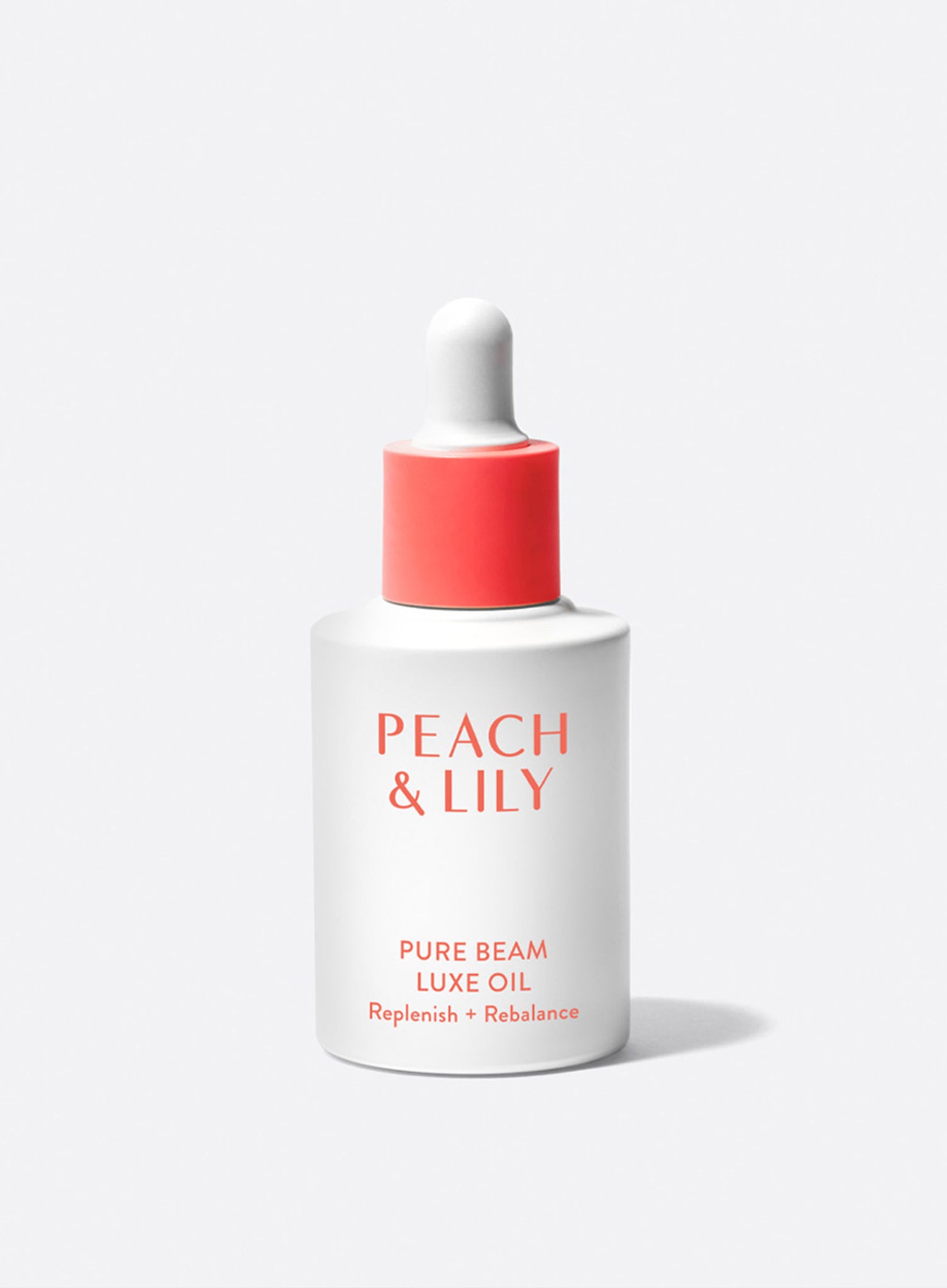 A bottle with a dropper of Peach & Lily Pure Beam Luxe Oil for replenishing and rebalancing skin