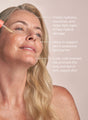 A woman applying balancing oil for combination skin with highlights about how it visibly hydrates, nourishes, and helps fight signs of free-radical damage, helps to support the skin's protective lipid barrier, and how the luxe, cold-pressed oils promote the look and feel of soft, supple skin