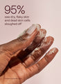 Someone rubs KP Bump Boss Microderm Body Scrub on their fingers with the results from a 3rd party consumer study where 95% of participants saw their dry, flaky skin and dead skin cells slough off