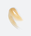 A smudge of Volufiline15 Eye Essence, showing off its pale gold color and thick, syrupy texture